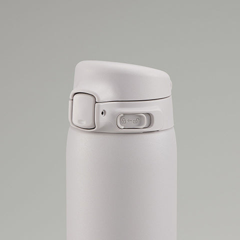 White thermos bottle with a gray background