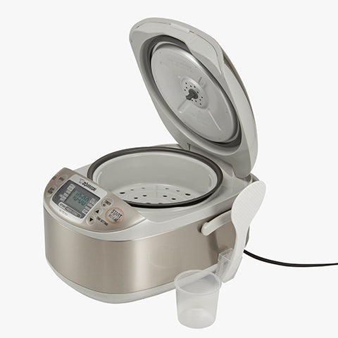 Accessories include steam basket, rice measuring cup, nonstick rice spatula and spatula holder
