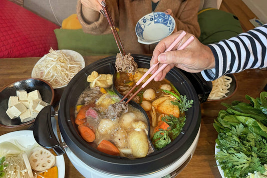 eating hot pot with chopsticks