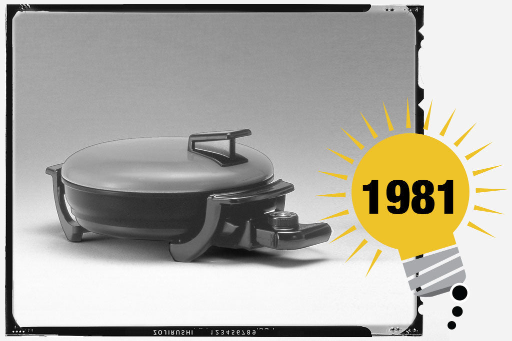 Black and white photo of Zojirushi’s first electric skillet. Photo is labeled with the year 1981.
