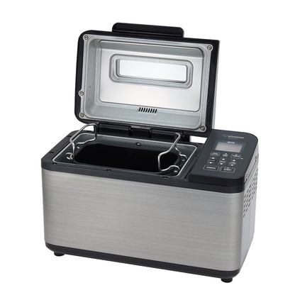 Bread machine with open lid on a white background