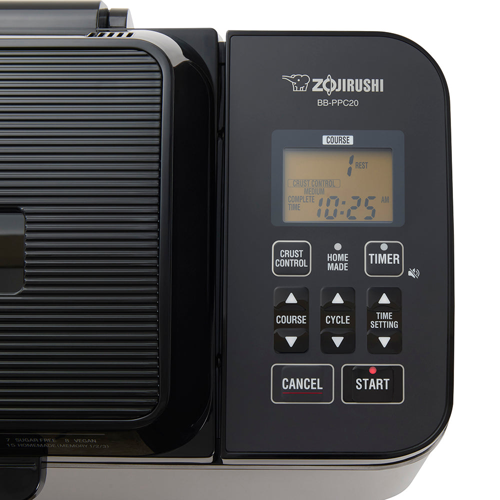 Zojirushi breadmaker with digital display and control panel on a white background